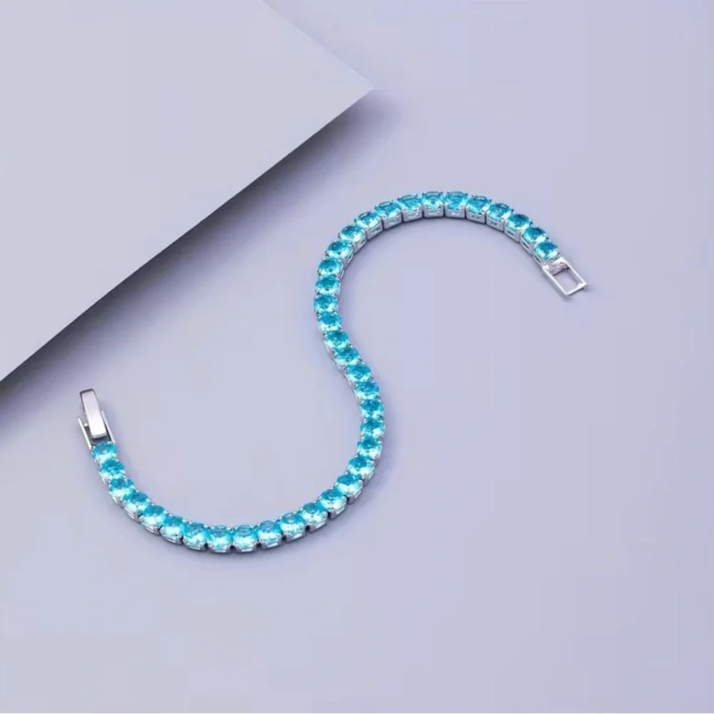 Beautiful Round Blue Topaz Bracelet In White Gold - Picture 8 of 12